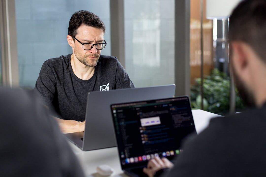 developer writing code on laptop