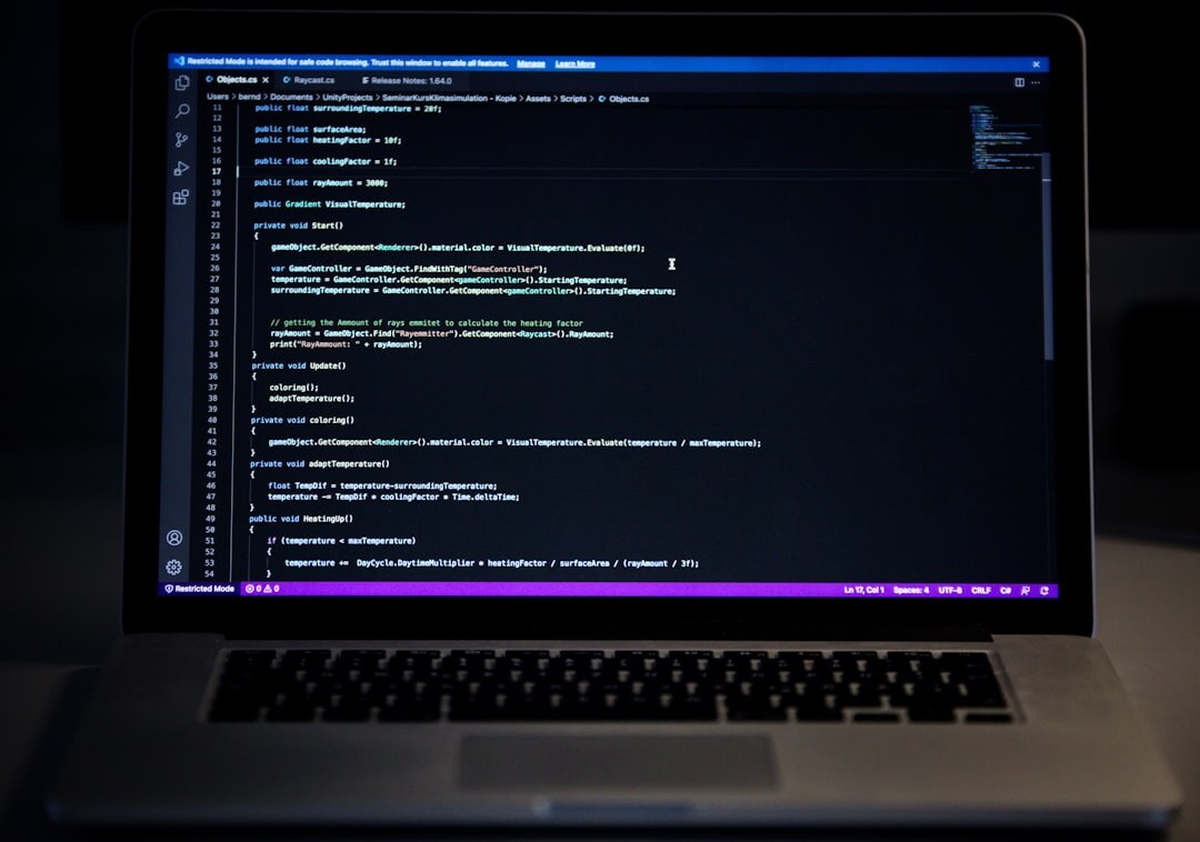 Close-up of a laptop screen showing colorful lines of code