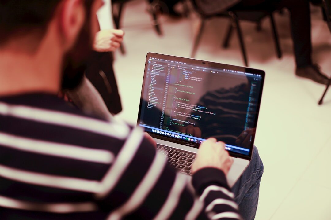 developer coding on laptop