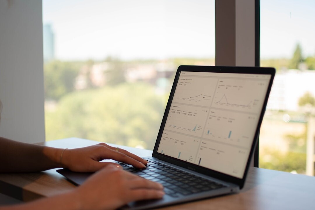 person coding on laptop